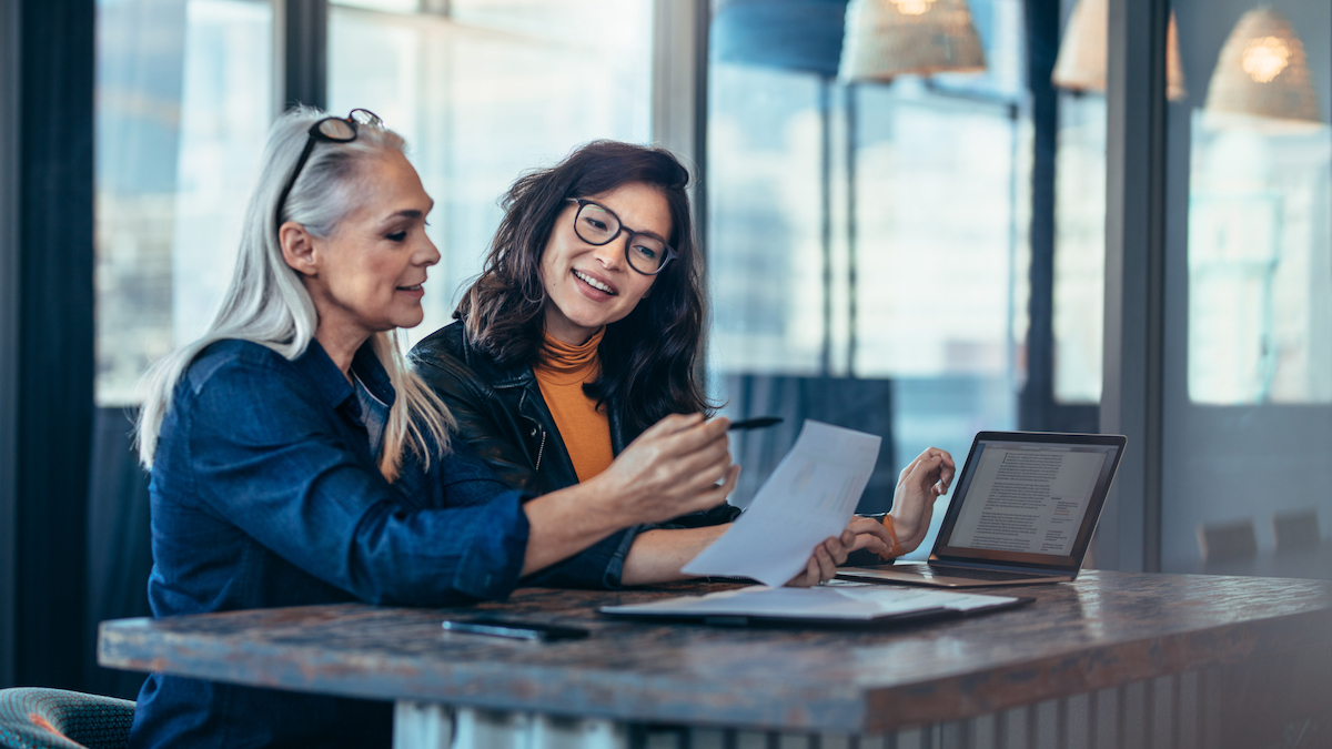 two women talking about applicant tracking system