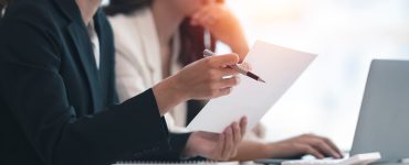 Two women saving money on job advertising