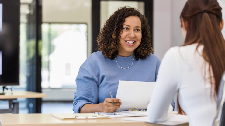 A woman interviewing another woman