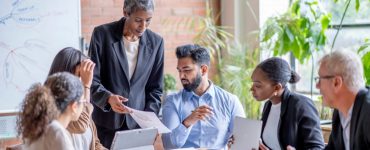 People sitting around a conference table discussing change