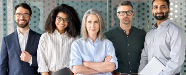 Talent Acquisition team members posing in an office