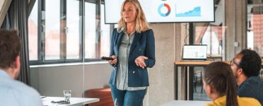 Woman discussing data-driven recruitment in a conference room