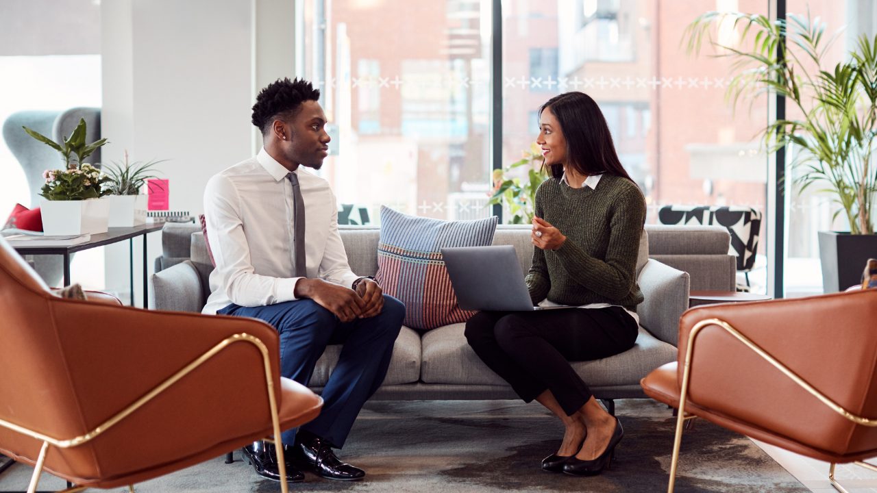 A woman interviewing a man for soft skills